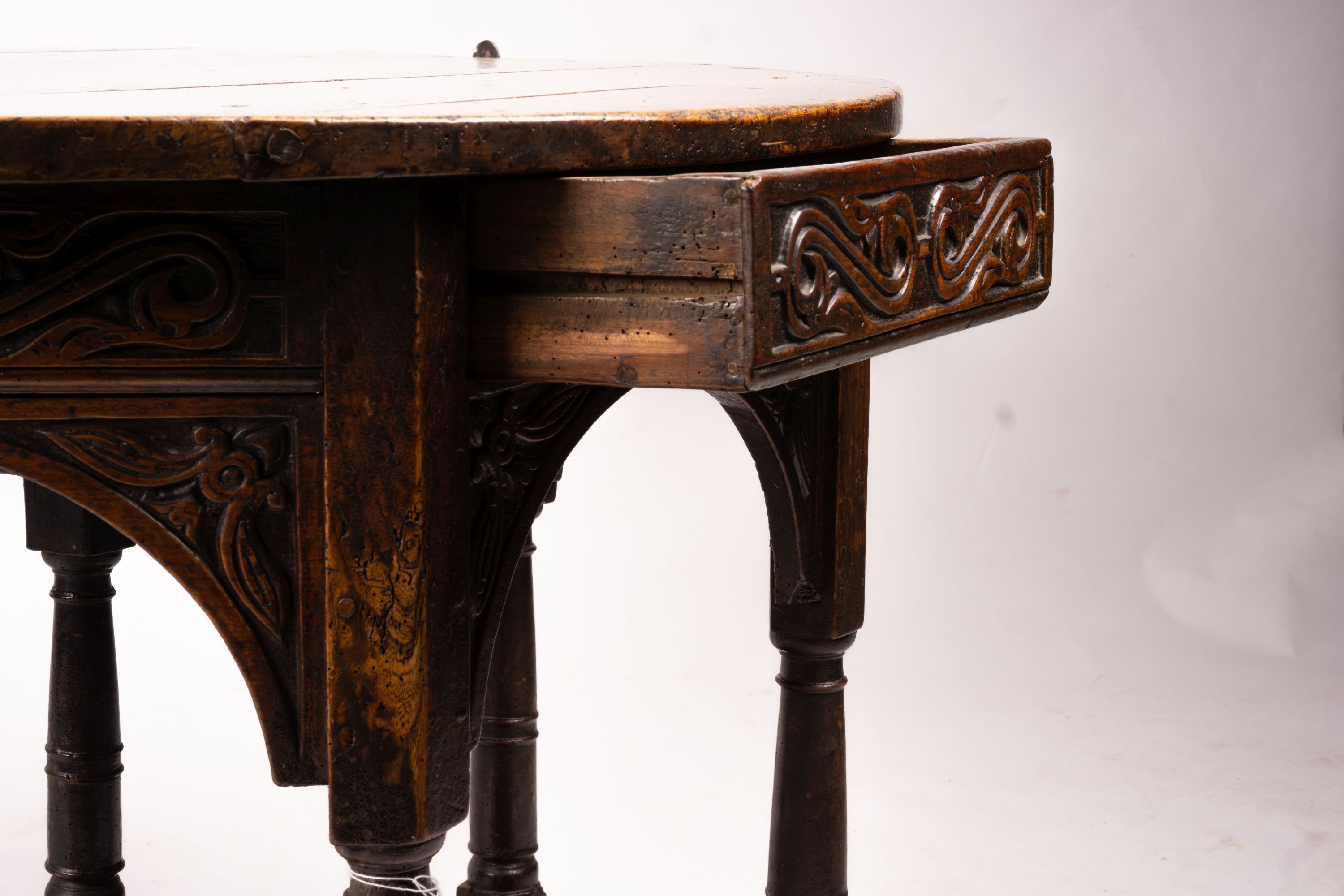 A 17th century oak credence table, width 108cm, depth 52cm, height 77cm